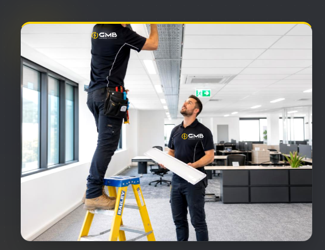 GMB electricians installing lighting during a commercial office fitout